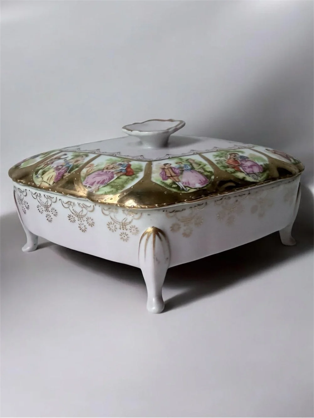 Ornate Footed Porcelain Box with Love Scenes
